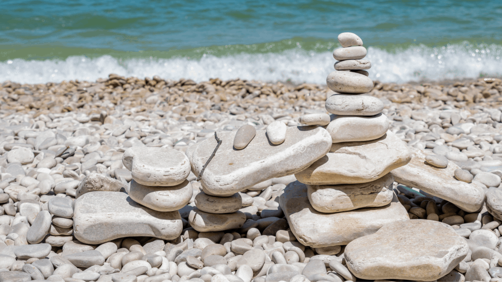 small rock pile on rock beach 