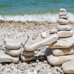small rock pile on rock beach