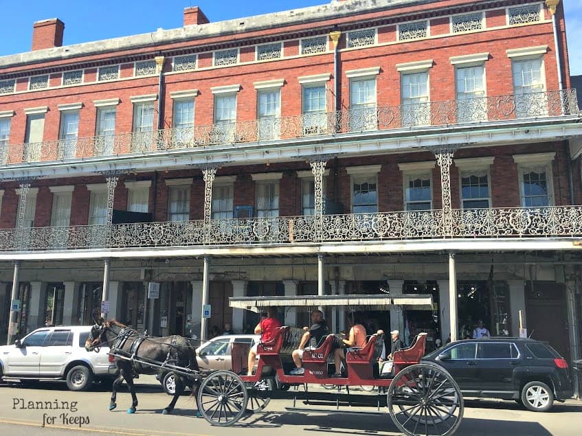 horse-drawn carriage in front of building