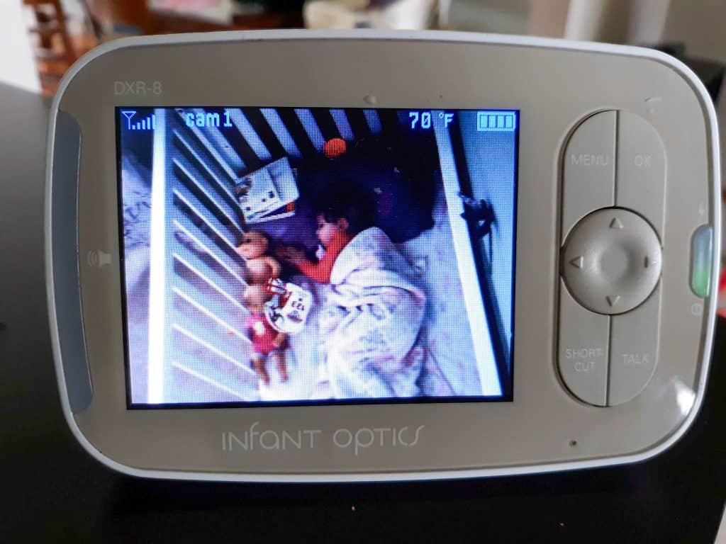 Video monitor of toddler sleeping in a crib