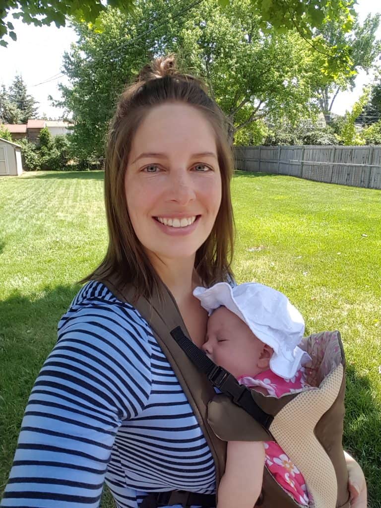 mom carrying baby in a front carrier