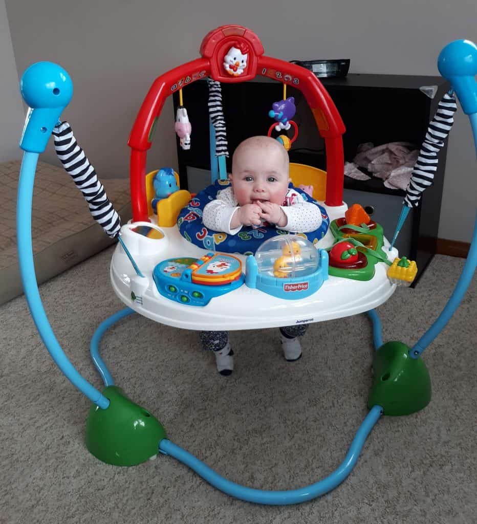 baby in farm-themed jumperoo