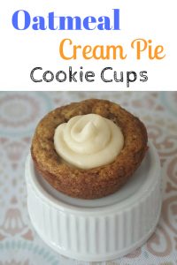 A delicious new take on the oatmeal cream pie cookie, these oatmeal cookie cups are filled with a yummy frosting center. #cookies #recipe