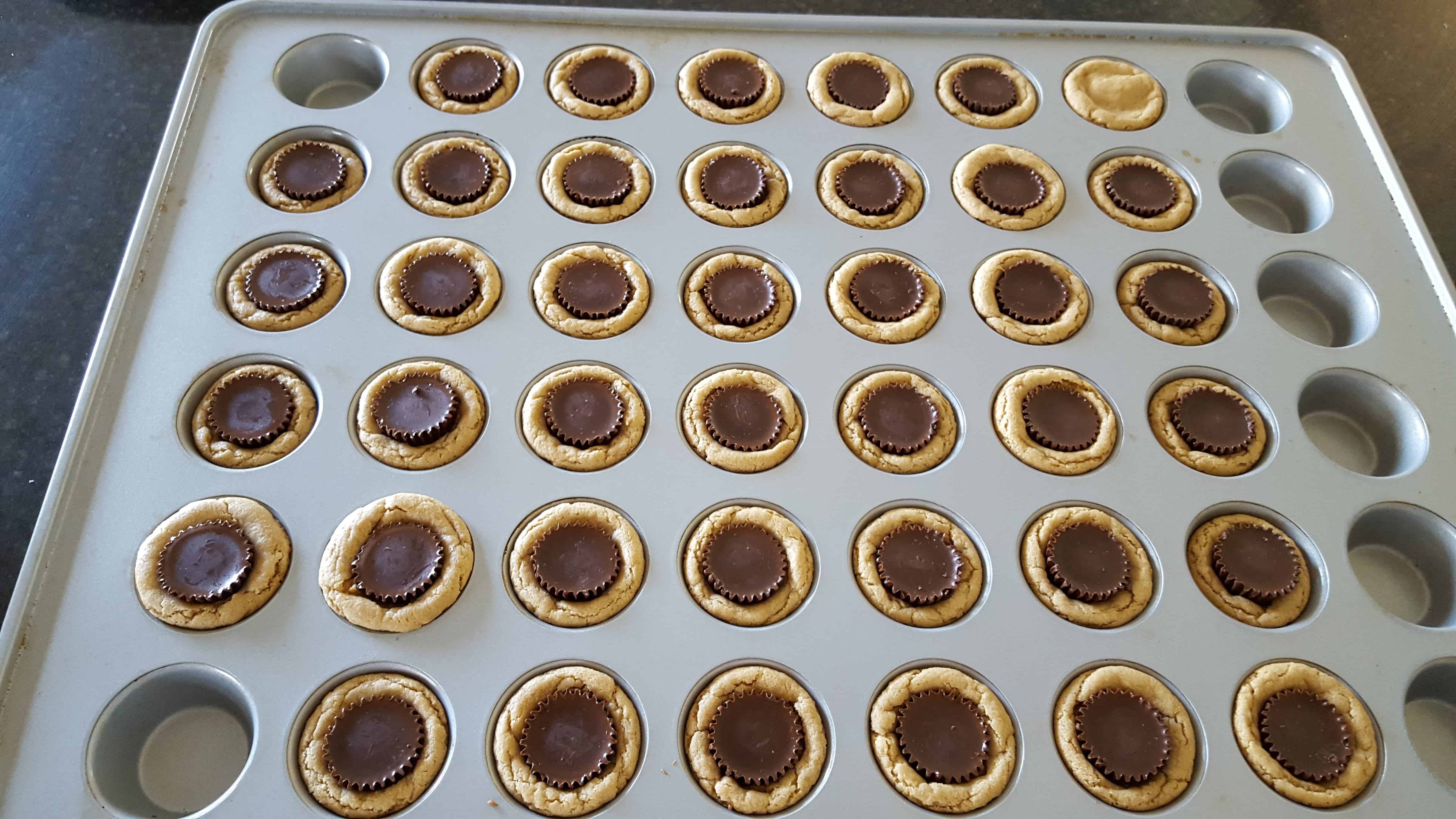 peanut butter cups centered in each muffin tin cup