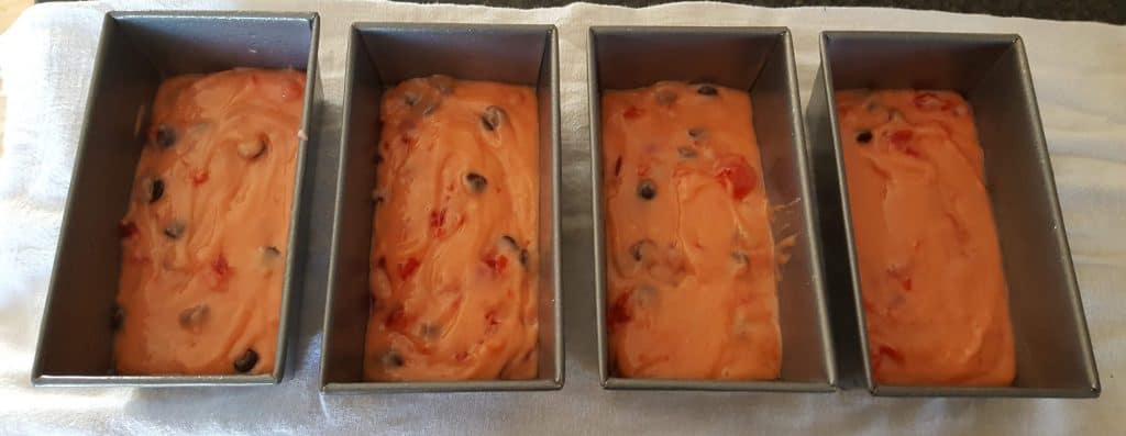 cherry chocolate chip bread batter in loaf pans