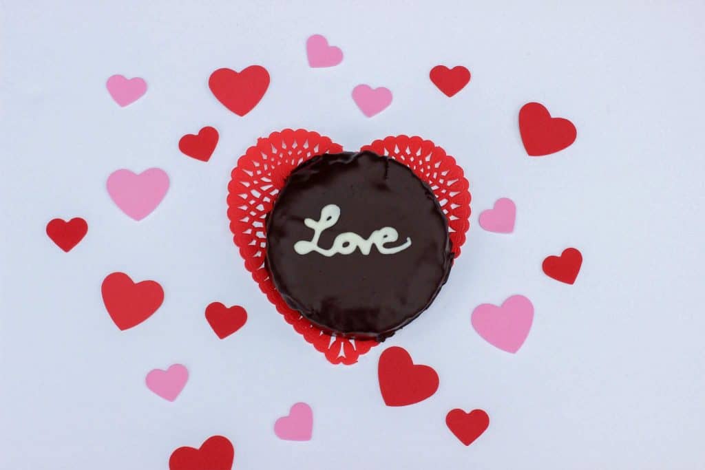 mini flourless chocolate cake with white chocolate writing "Love"