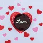 mini flourless chocolate cake with white chocolate writing "Love"