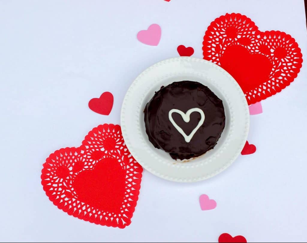 mini flourless chocolate cake with white chocolate heart garnish