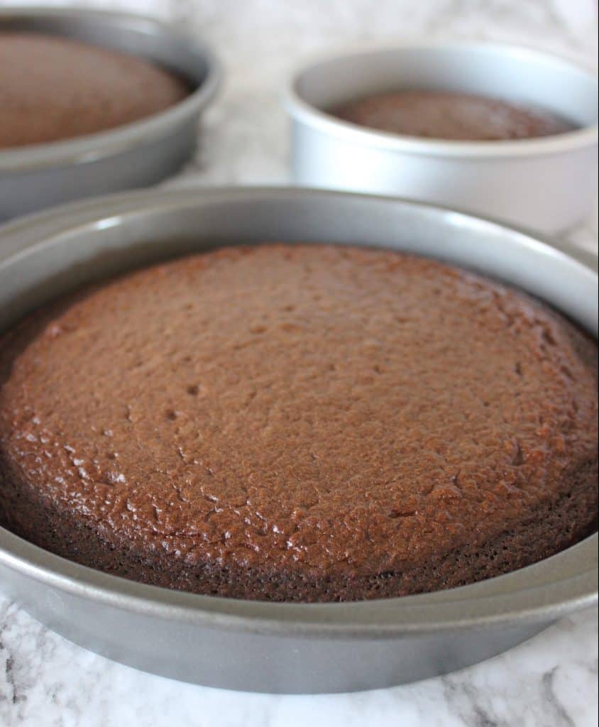 chocolate cake in three cake pans