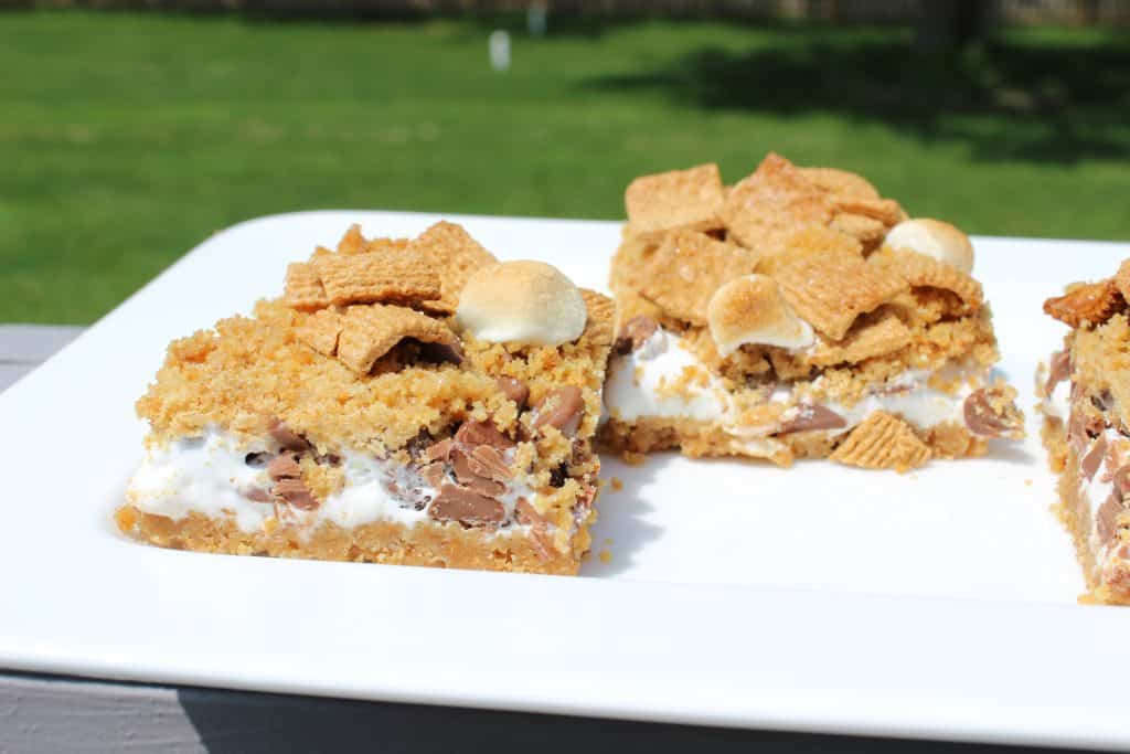 cut Messy Mallow Bars on a white platter