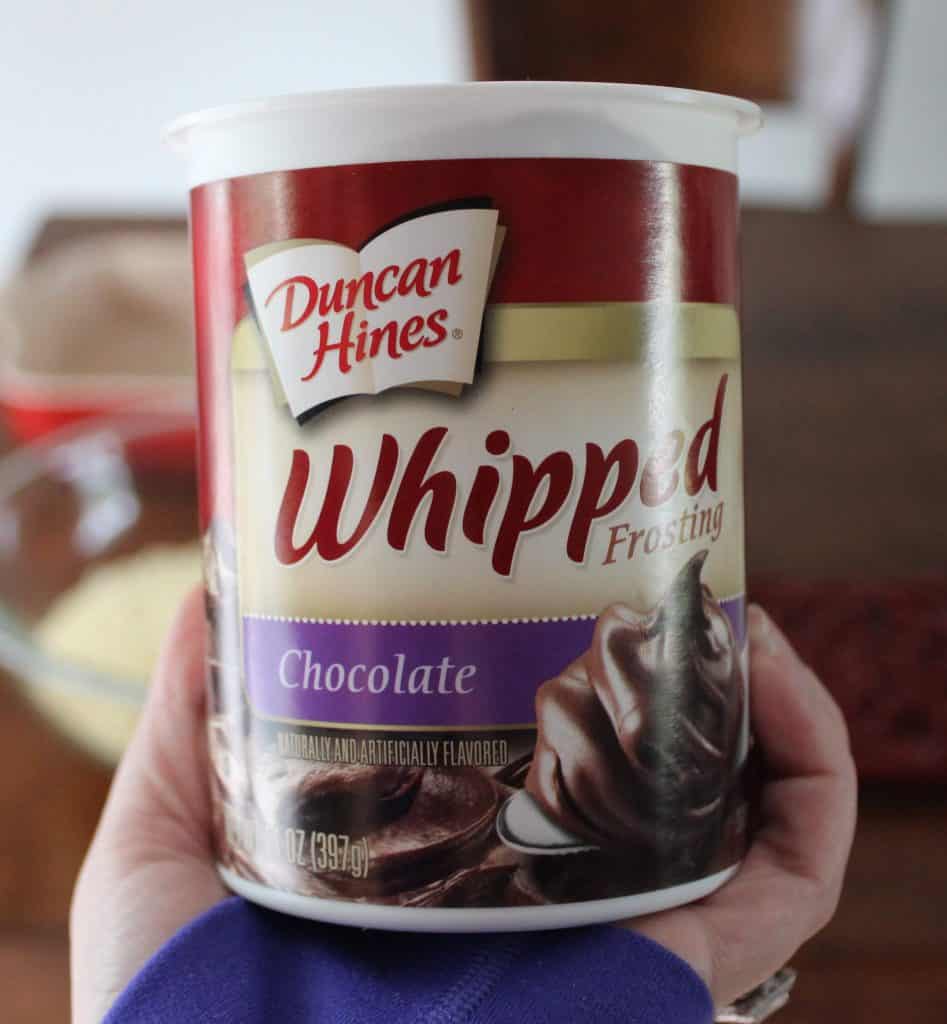 A can of Duncan Hines whipped chocolate frosting