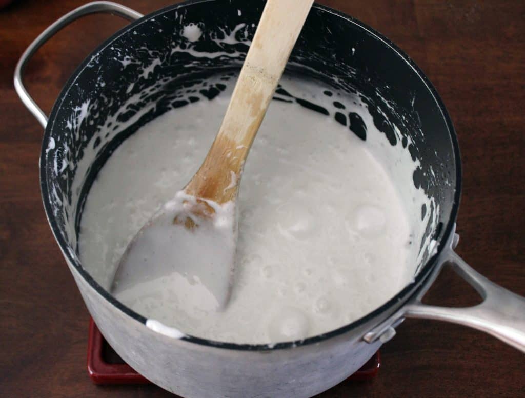 melted marshmallows in saucepan with wooden spoon