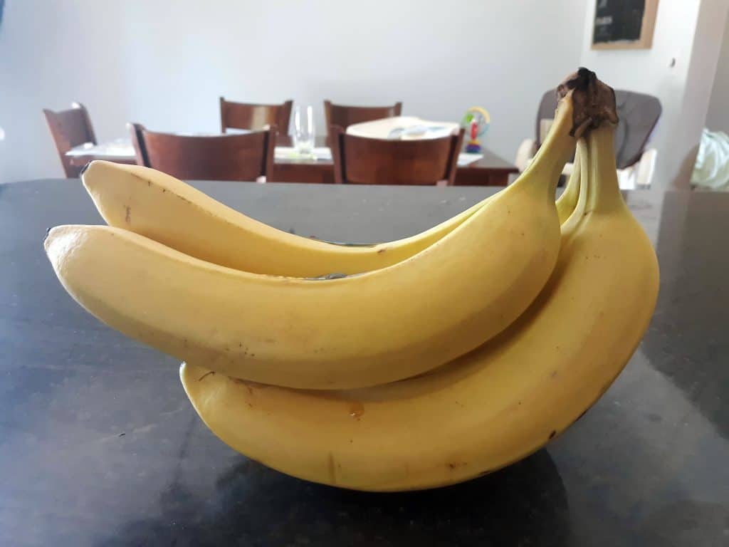 a bunch of bananas sitting on a counter