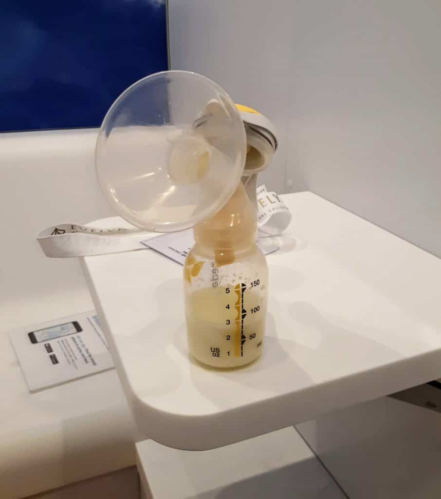 manual breast pump on top of a small shelf