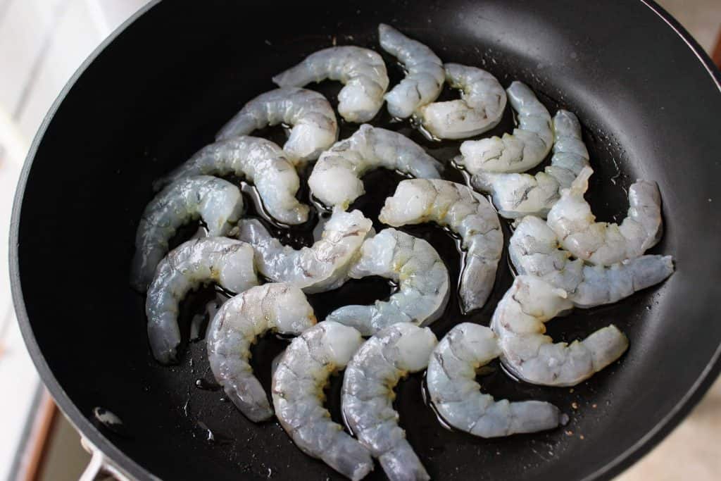 raw shrimp in saucepan