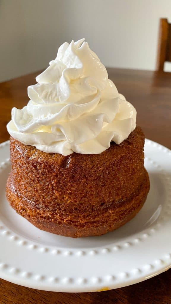 pumpkin caramel lava cake with whipped cream on top