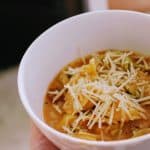 a bowl of tortellini soup