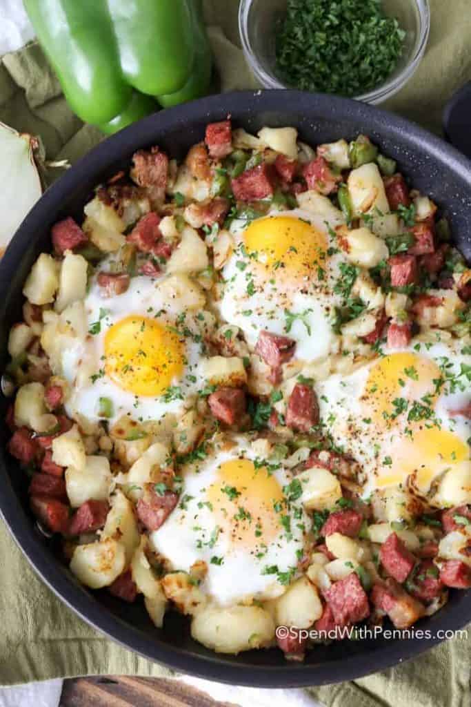 corned beef hash with eggs in skillet