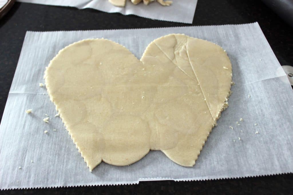 sugar cookie dough cut into the top of a heart