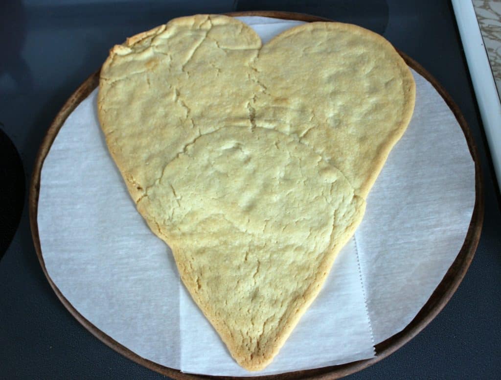 baked sugar cookie crust in the shape of a large heart