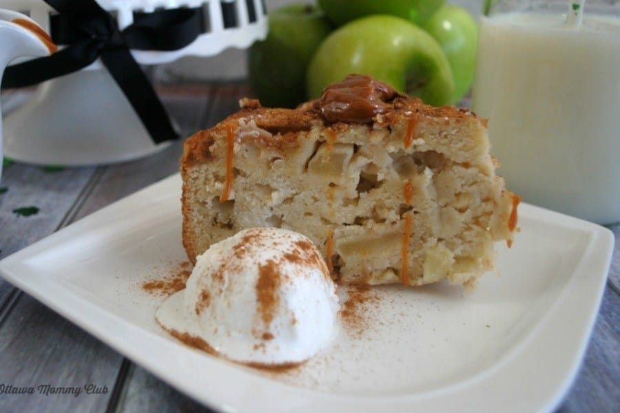 a slice of apple cake with a scoop of vanilla ice cream on the side