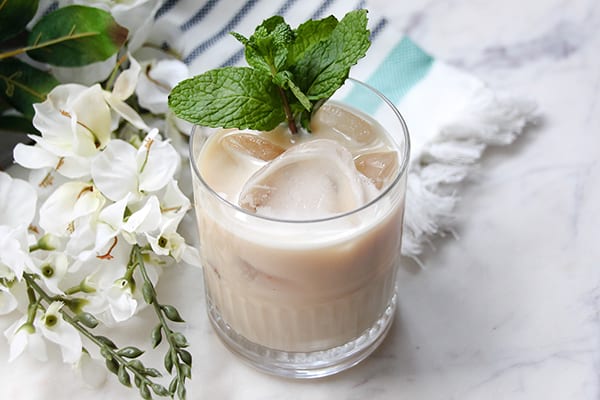 mint irish cream whiskey in a glass with a mint leaf garnish