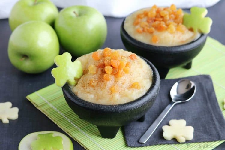 small black pot of apple sauce with shamrock apple garnish