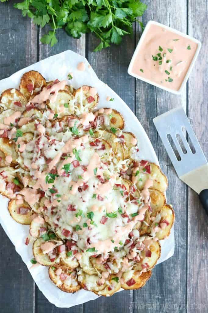 reuben topped nachos on a white platter