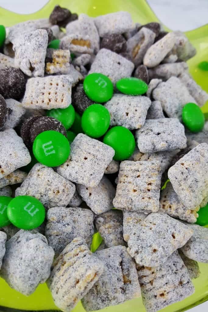 muddy buddies with green M&Ms and chocolate chips