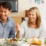 A family of four eating a meal together