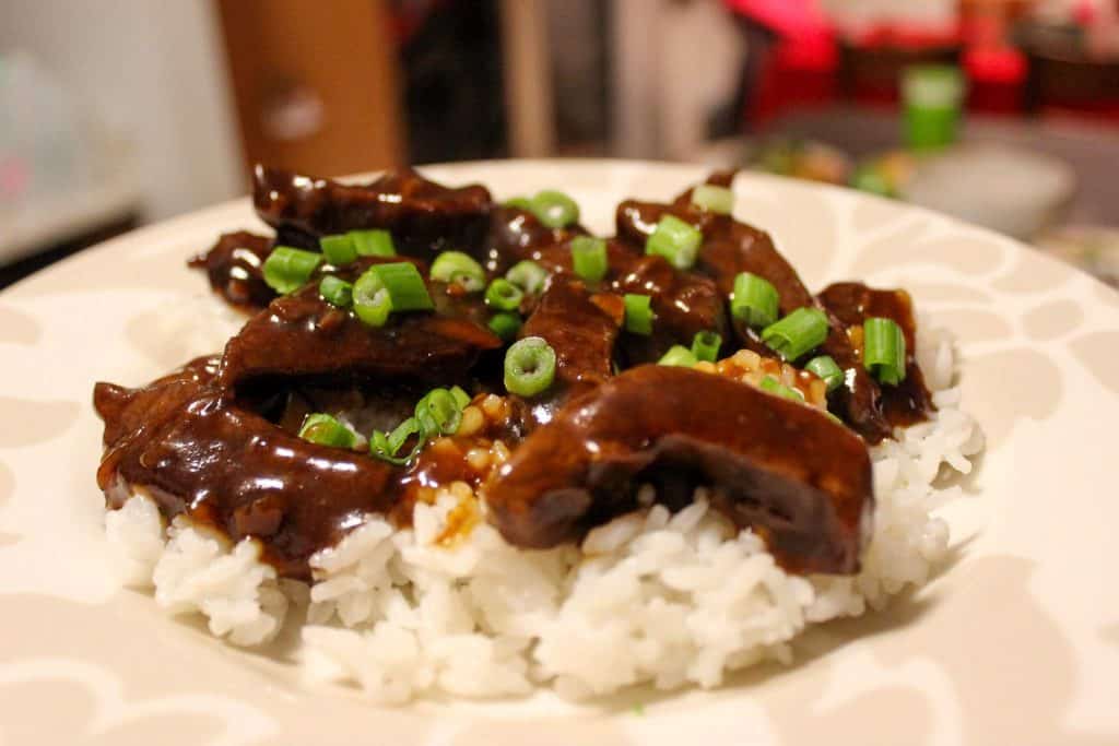 mongolian beef on top of white rice