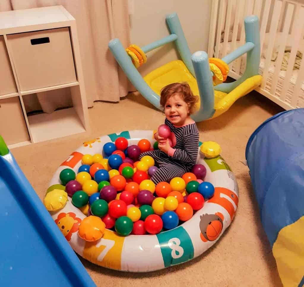 toddler in small ball pit