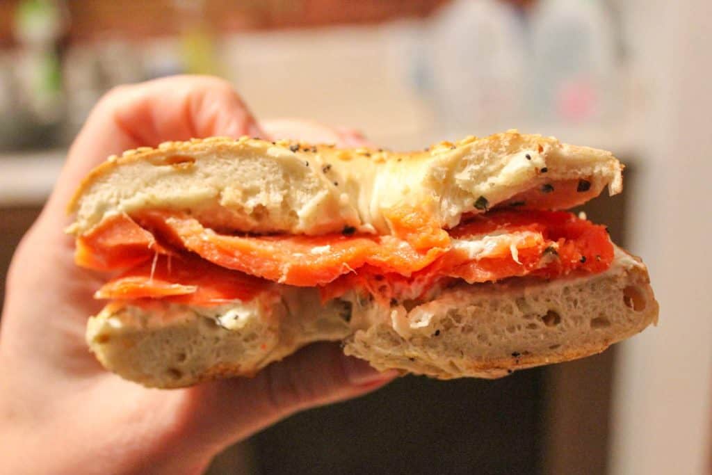 Half a bagel filled with smoked salmon