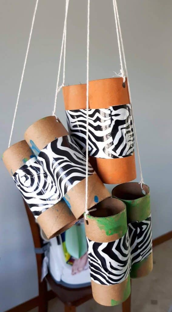 three DIY binoculars hanging by their strings