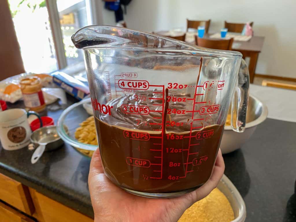 liquid measuring cup half full of melted chocolate