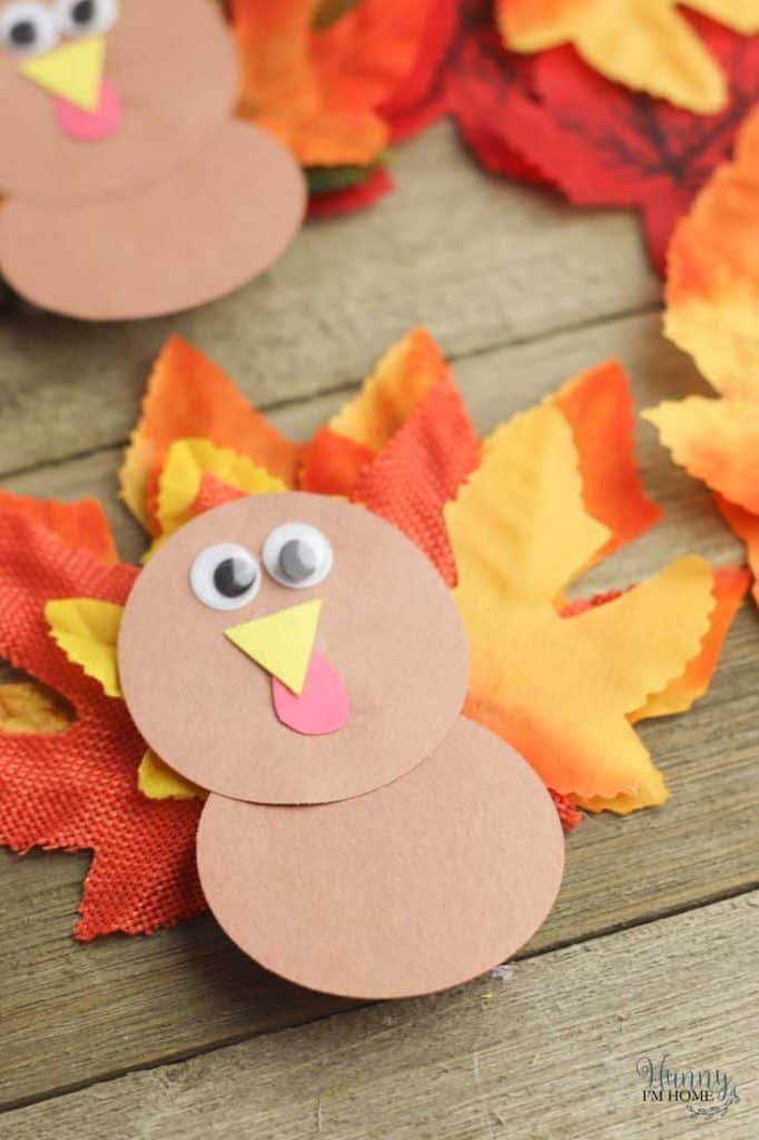 turkey made of construction paper and faux leaves