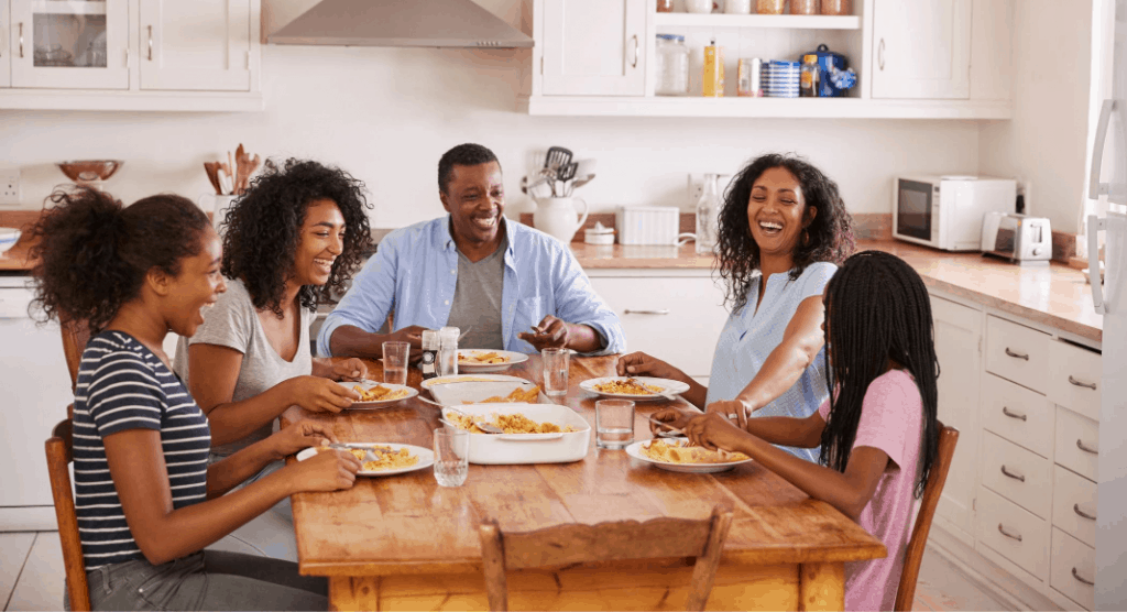 family sitting at a dining table