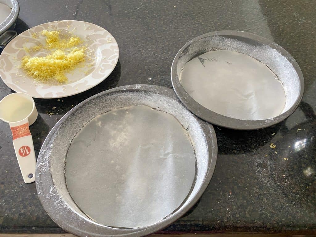 cake pans that have been greased and floured with a parchment round on the bottom