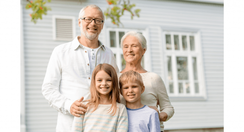 two grandparents standing behind two grandchildren