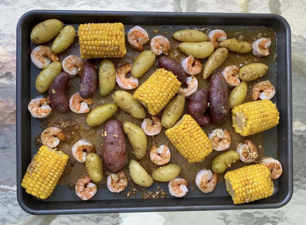 sheet pan with shrimp, corn on the cob, and potatoes