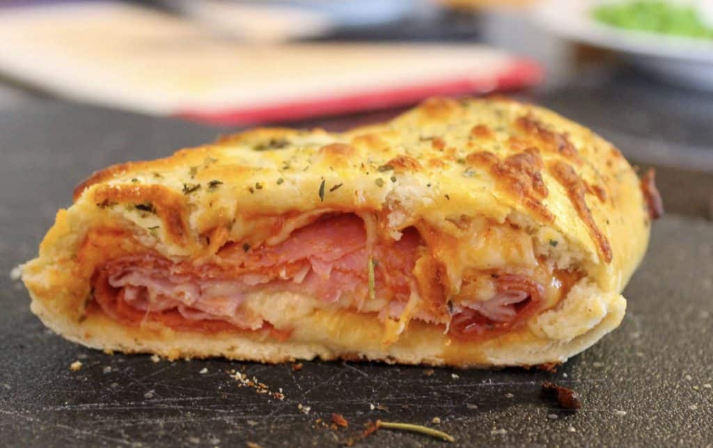 a slice of stromboli in which you can see the layers