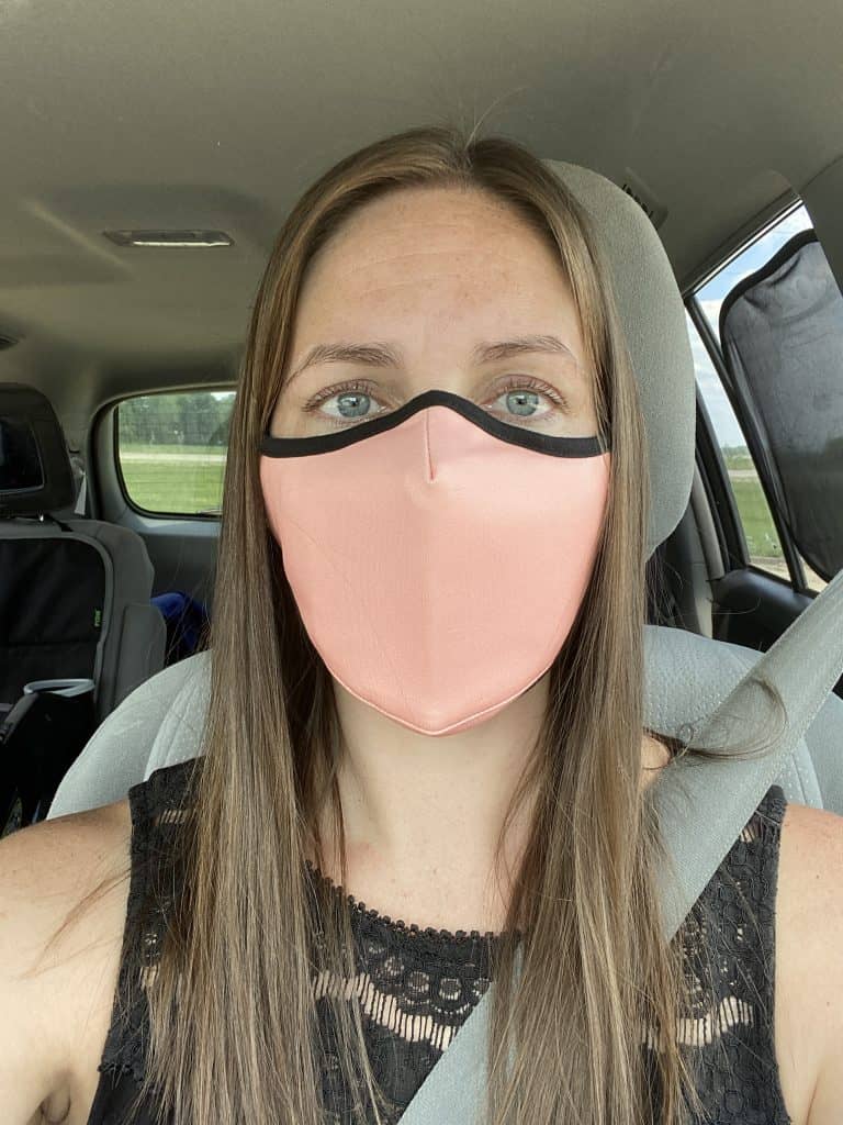 author wearing reusable pink face mask