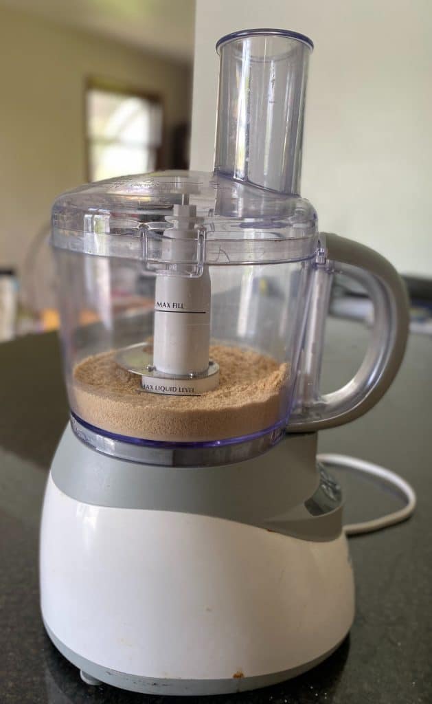 food processor with graham cracker crumbs inside