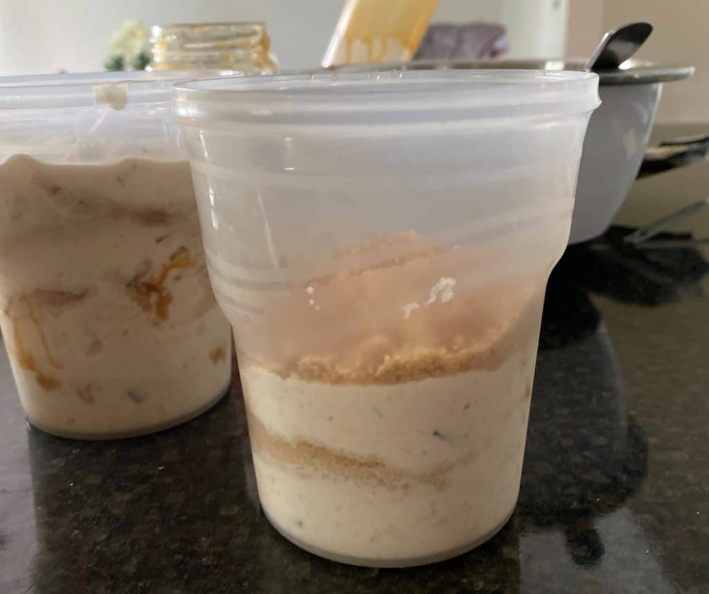 container half full of banana graham ice cream