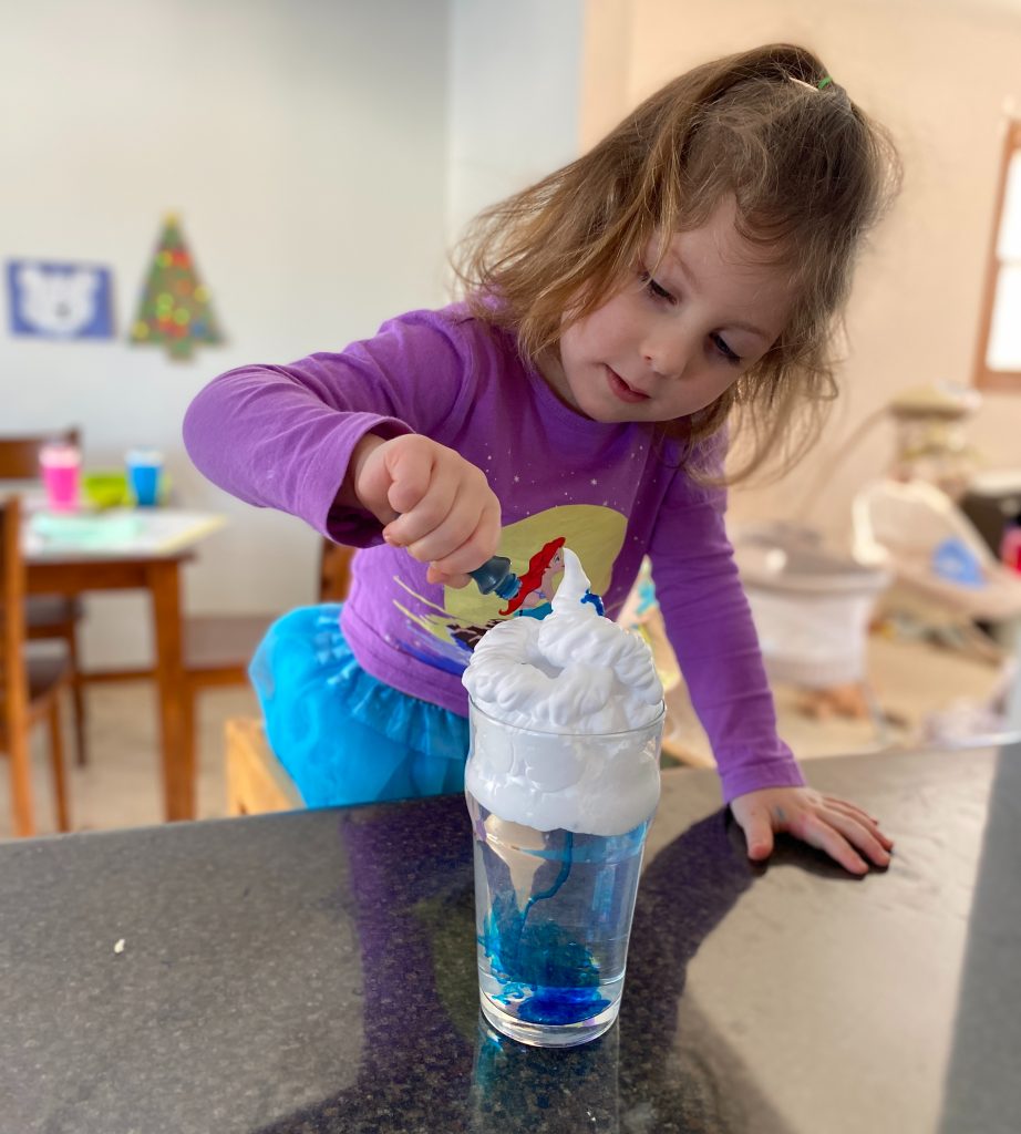 preschooler learning about clouds with experiment