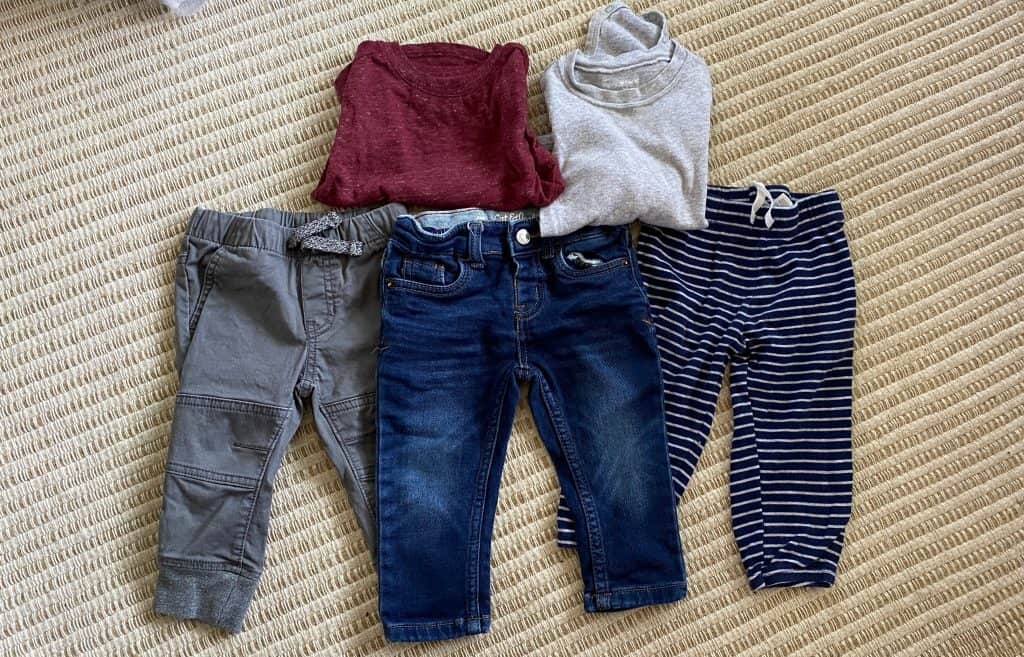 three pairs of boys pants with two tops