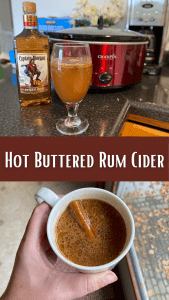 slow cooker with hot buttered rum apple cider