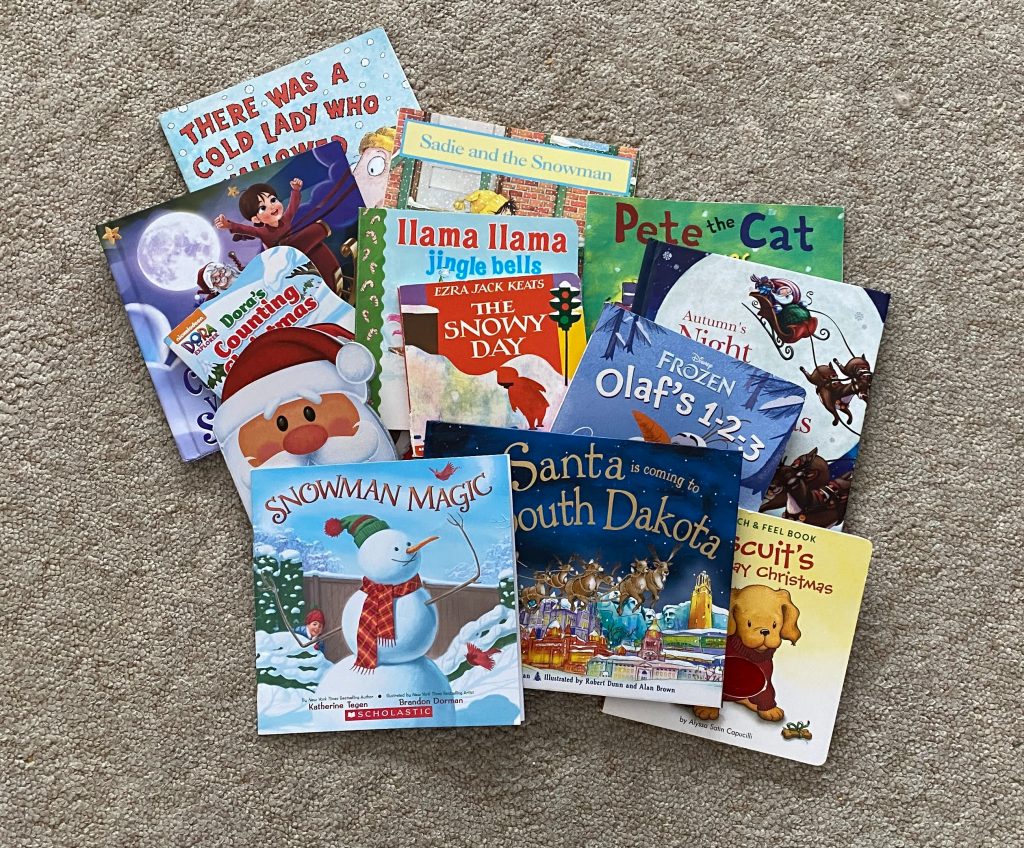 a pile of Christmas children's books