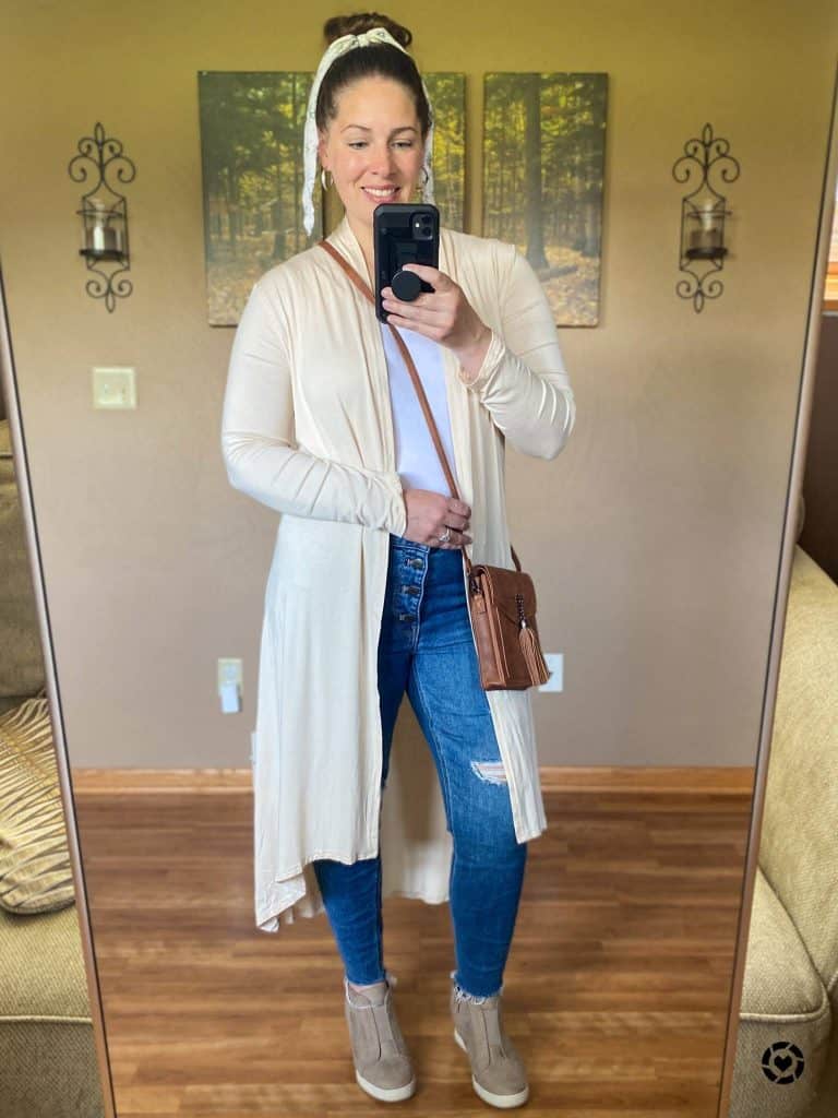 author wearing a small crossbody purse