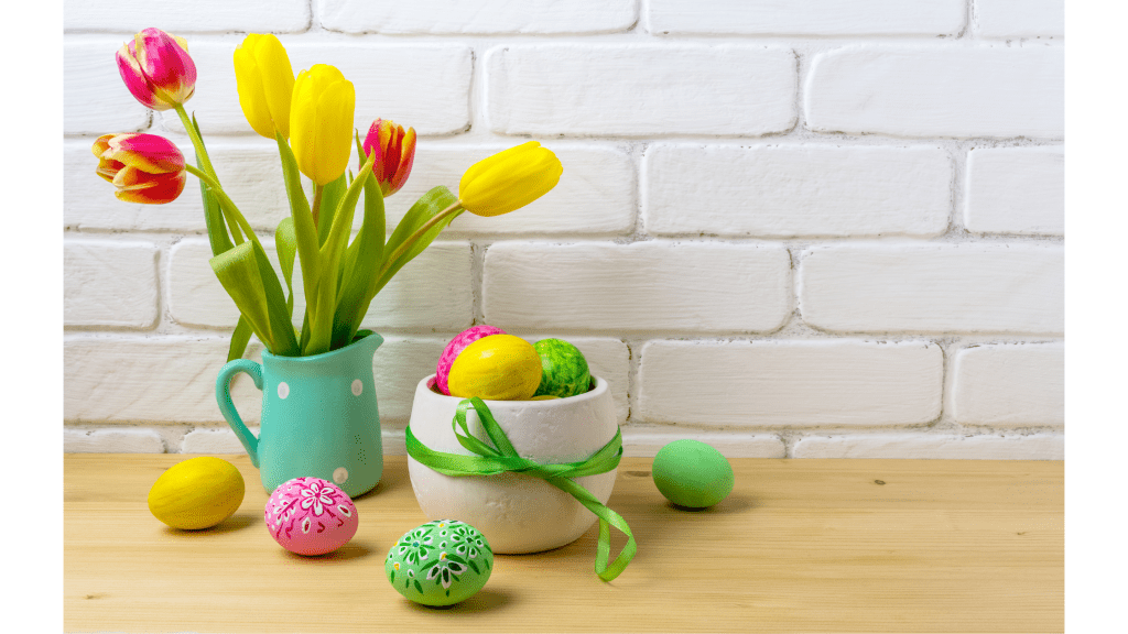 spring vase with tulips and colored eggs on counter
